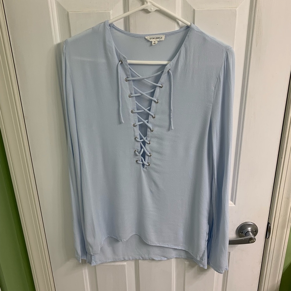 Light blue long sleeve lace up top size medium